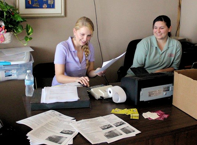 Amber and Bianca in office on sale day.