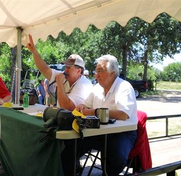 Randy selling under a tent out in the country.